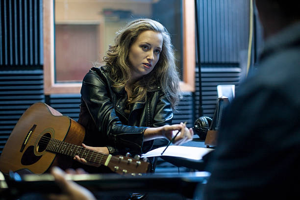Songwriter working in a recording studio