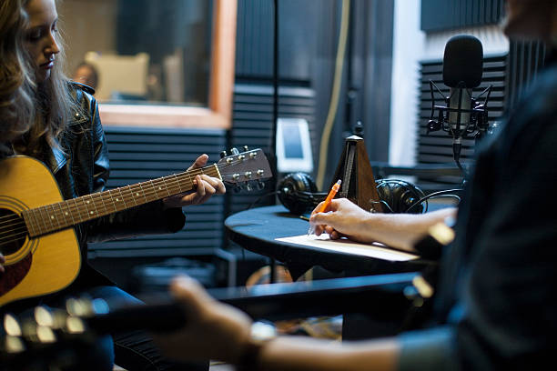 Musicians working through the songwriting process